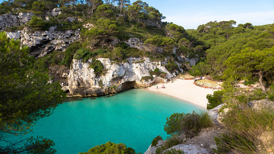 Cala Turqueta, a cove with white sand and turquoise water