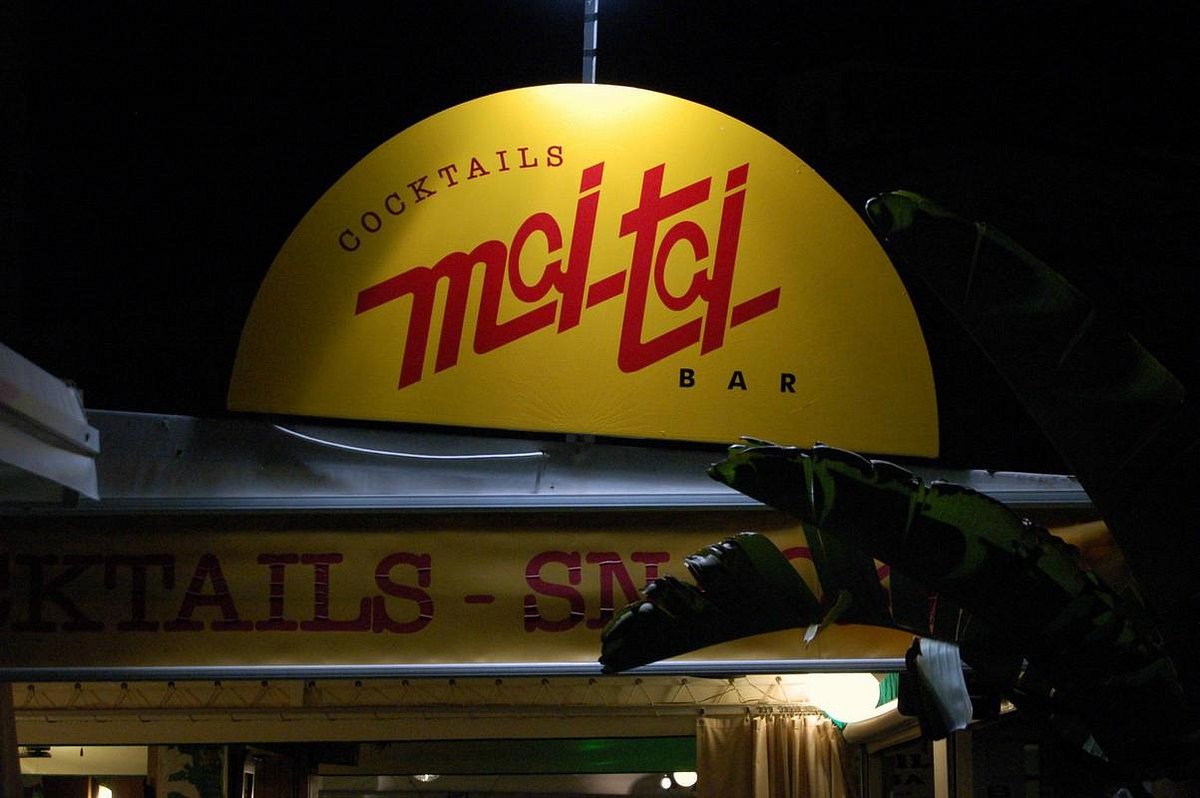 Mai Tai's illuminated cocktail sign at night