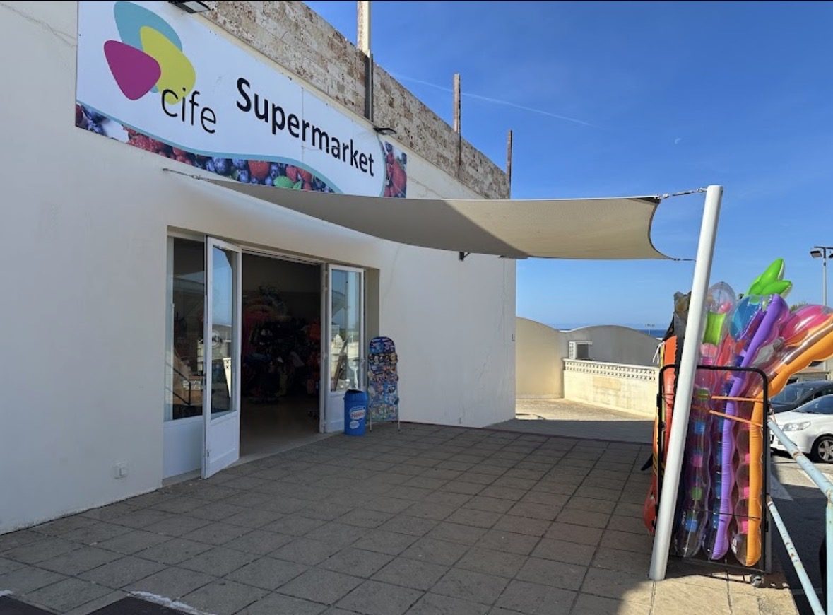 A local grocery storefront near Son Bou