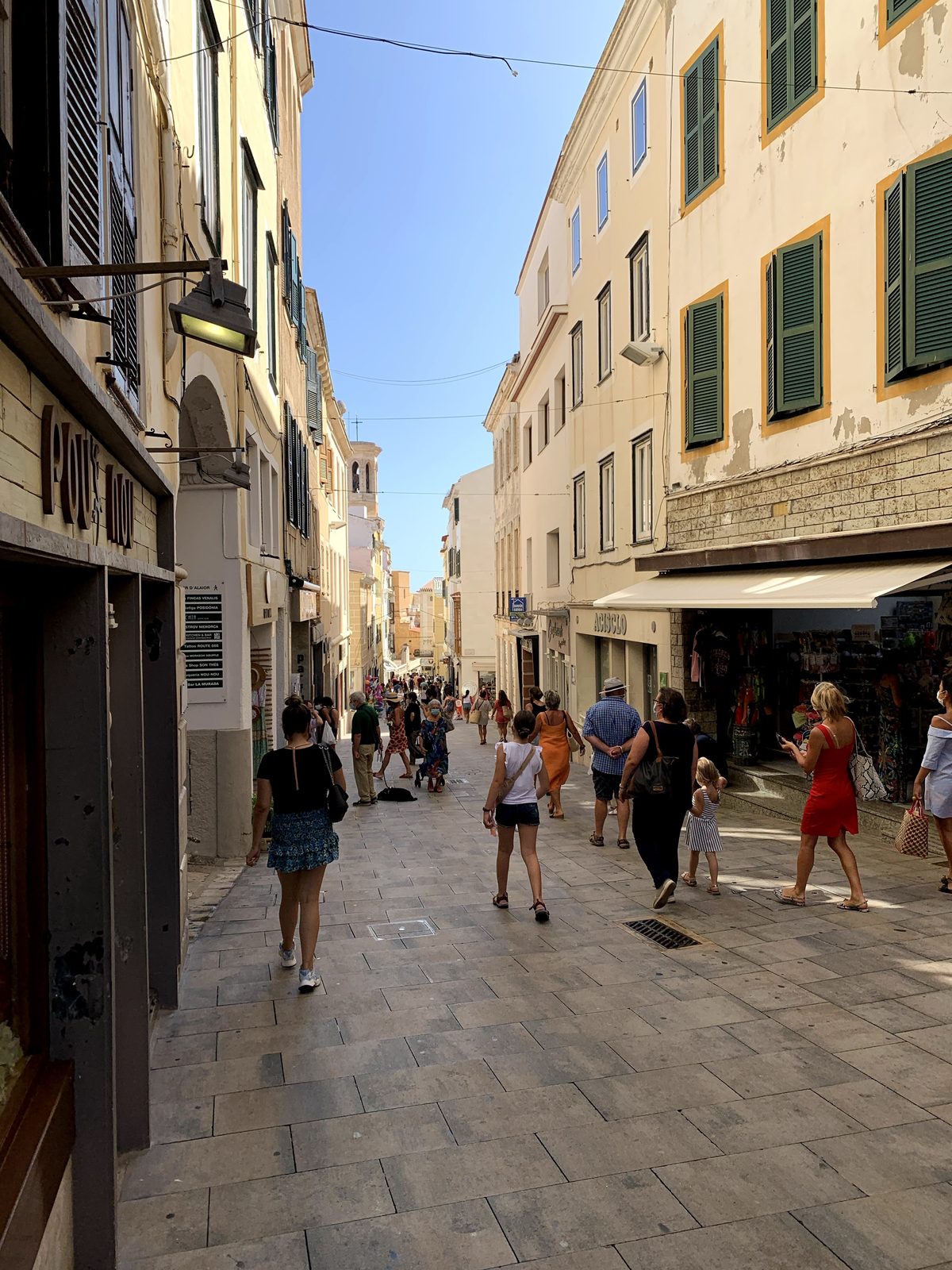 A narrow shopping street in Maó's old town