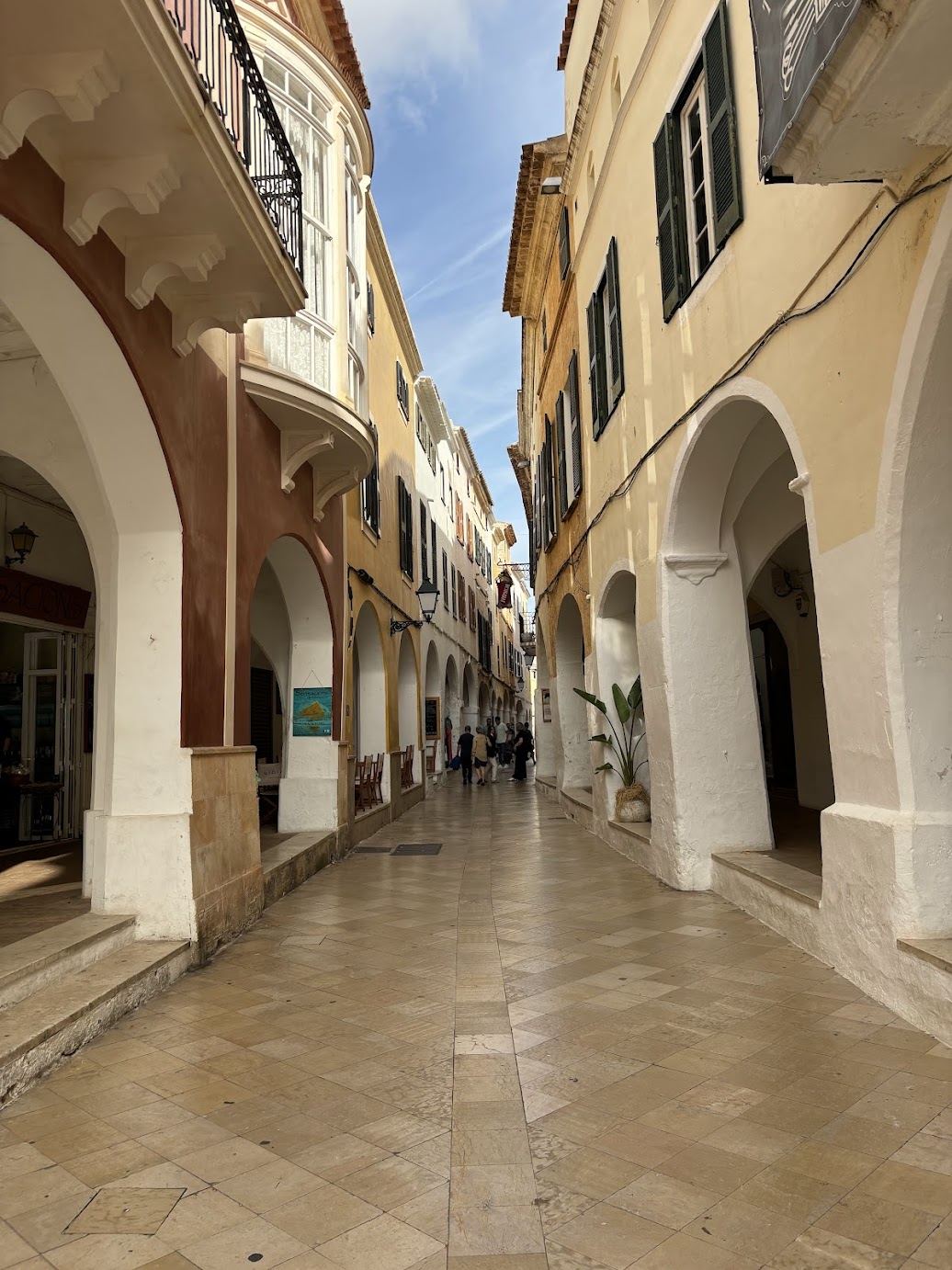 An arcaded stone street in Ciutadella's old town