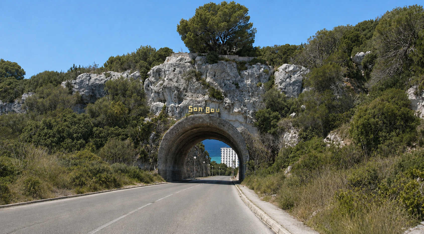 Road passing through the Son Bou tunnel carved into the rock
